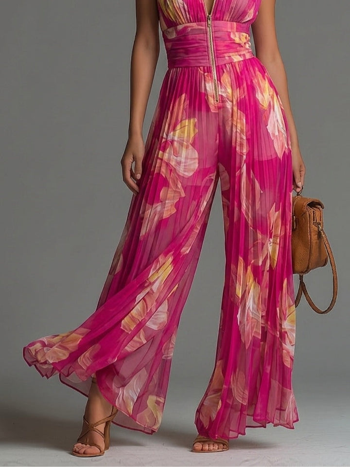 Tuta senza maniche in chiffon plissettata con zip e stampa floreale fucsia